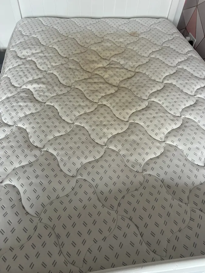 Discoloured mattress restored in Staffordshire, before professional cleaning