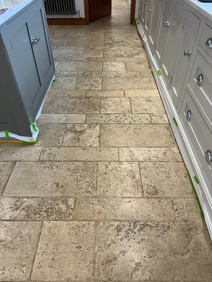 Restored tiled hallway floor in Staffordshire after professional cleaning, shown before and after, before professional cleaning